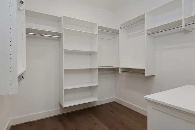 a view of an empty walk in closet