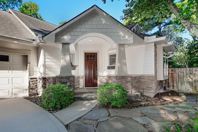 a front view of a house with garden