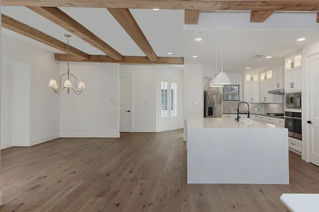 a view of kitchen with furniture and wooden floor