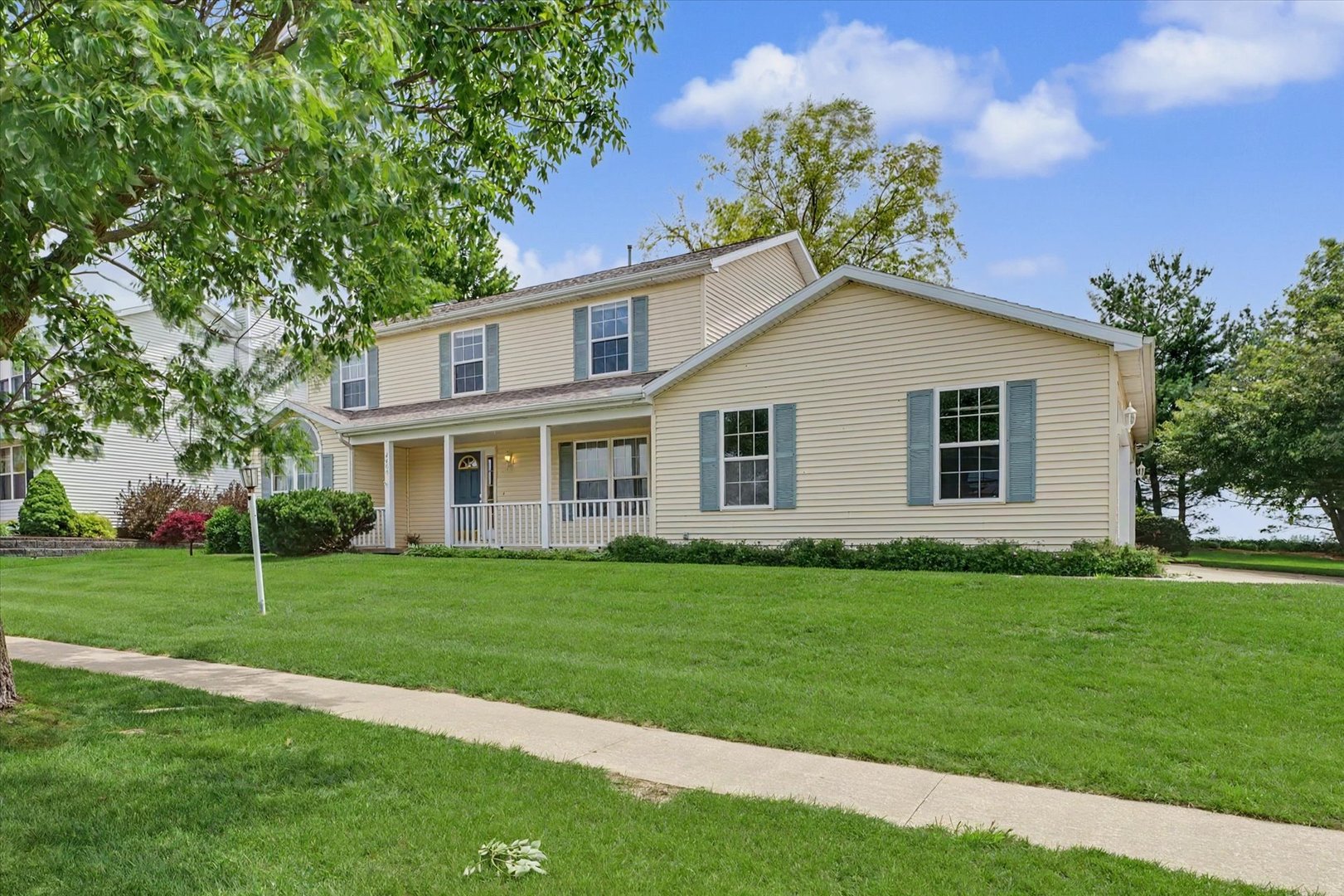 4409 Copper Ridge Road Champaign, IL 61822 - Photo 3 of 40 a front view of a house with a garden