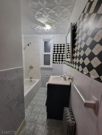 a bathroom with a bathtub and sink