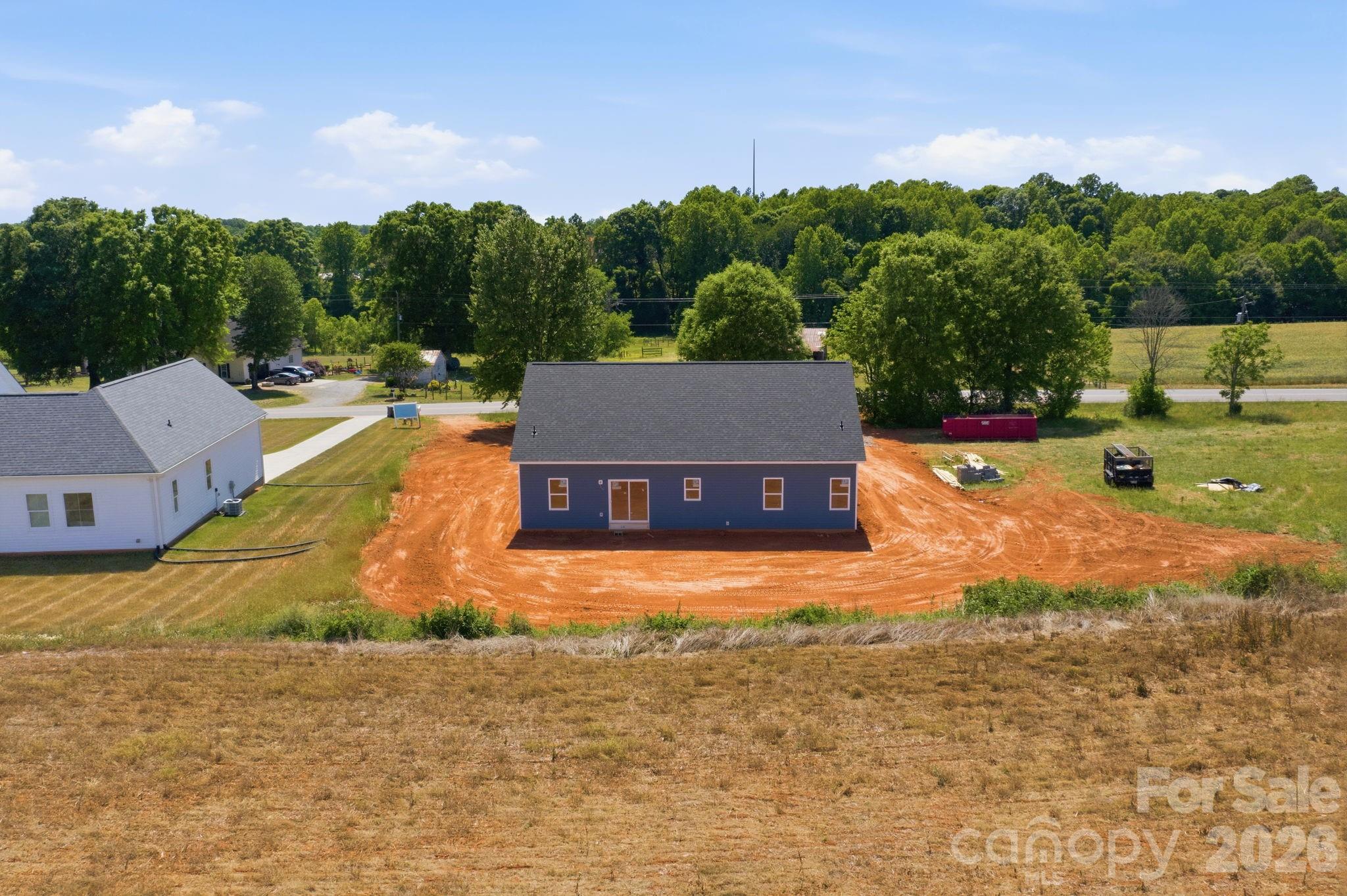 1720 Jennings Road Olin, NC 28660 - Photo 13 of 15 a view of a house with pool and a yard