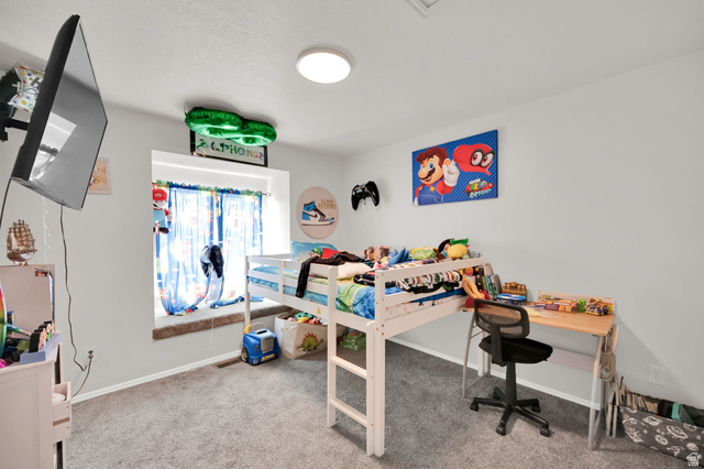 1284 North 900 West Clinton, UT 84015 - Photo 22 of 22 Bedroom with light colored carpet and baseboards