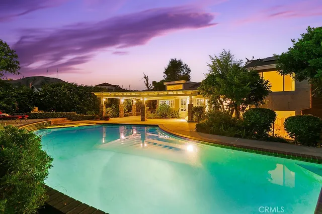 a view of swimming pool with a yard