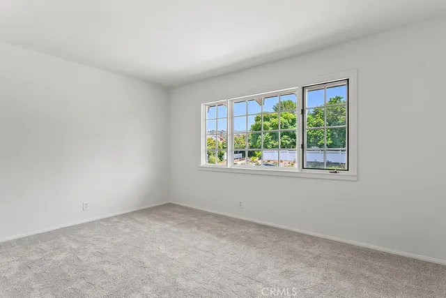 a view of a swimming pool with a yard