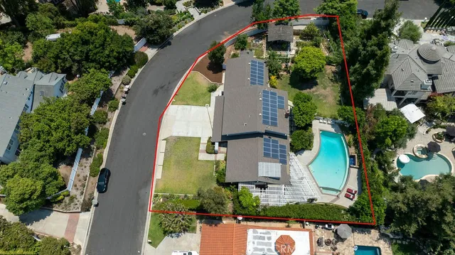 a view of a pool with a yard