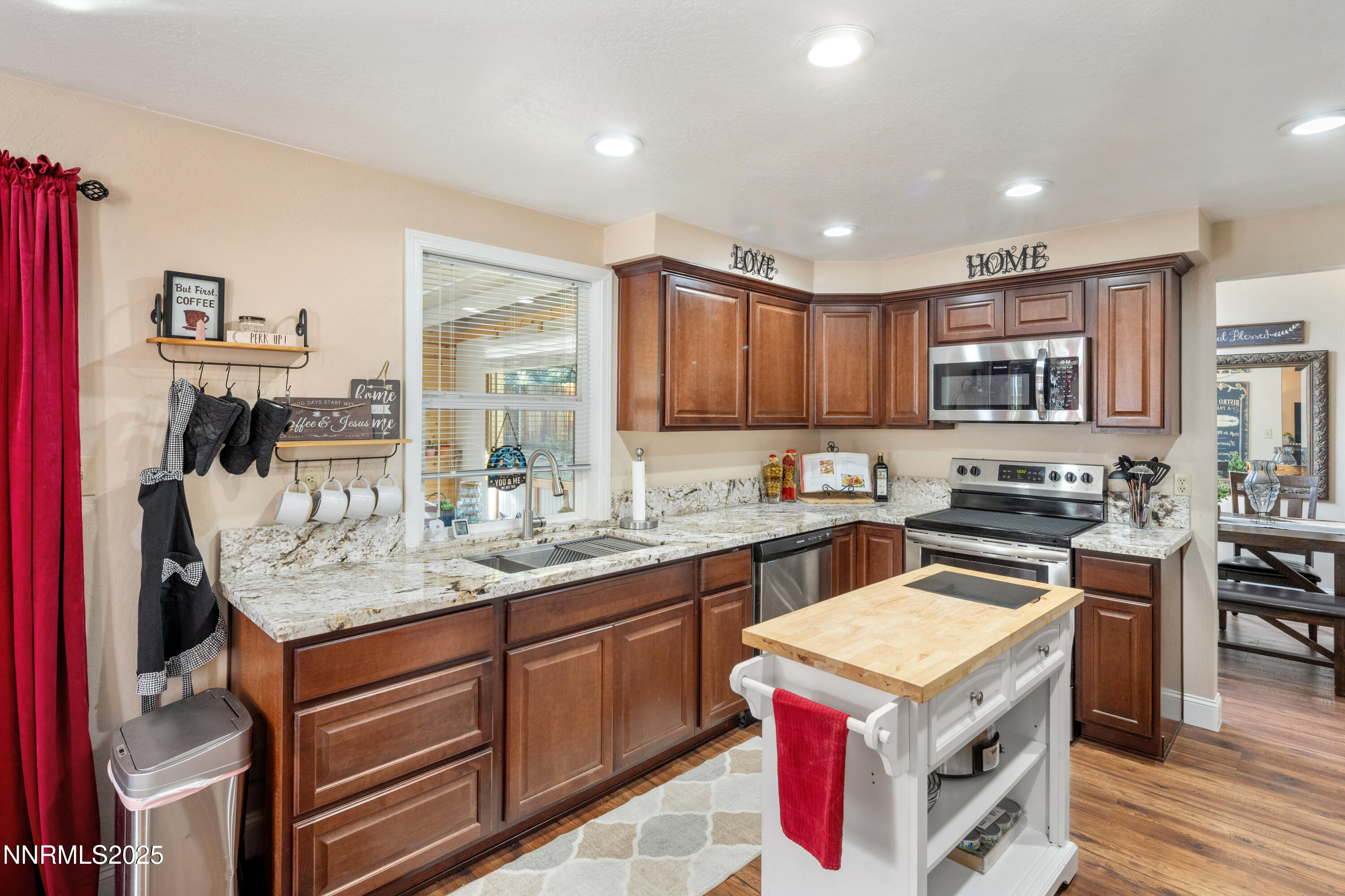 6310 Park Place Reno, NV 89523 - Photo 16 of 43 a kitchen with a stove sink and cabinets