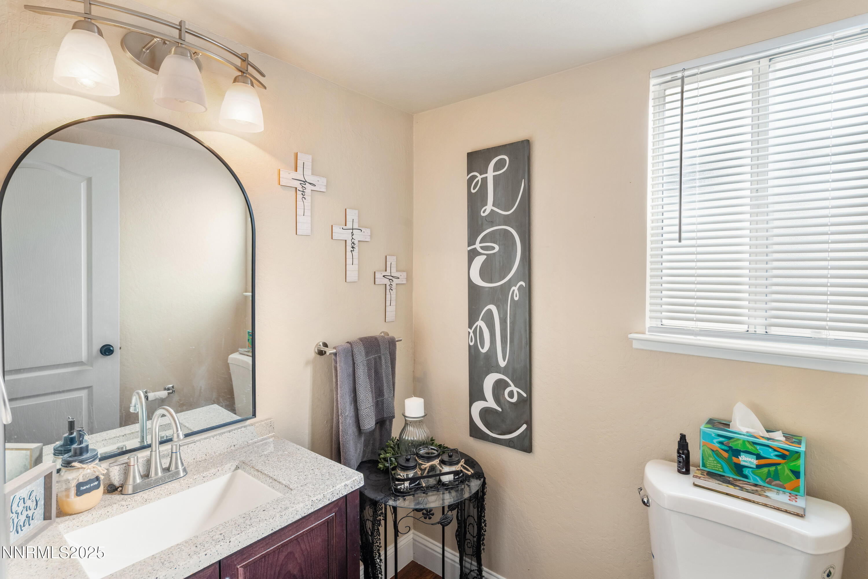 6310 Park Place Reno, NV 89523 - Photo 19 of 43 a bathroom with a sink a toilet and a mirror