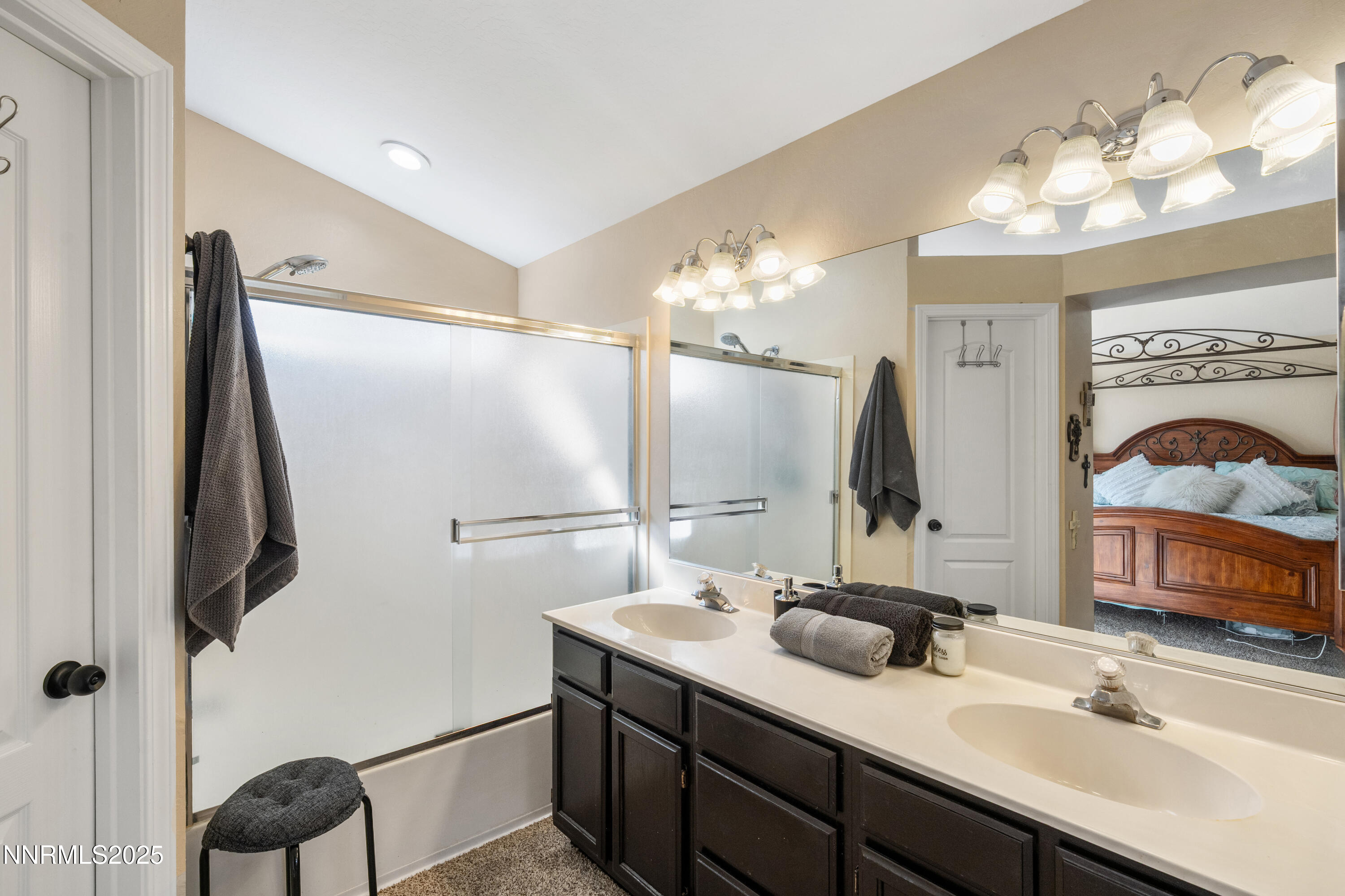 6310 Park Place Reno, NV 89523 - Photo 28 of 43 a bathroom with a double vanity sink a mirror and shower