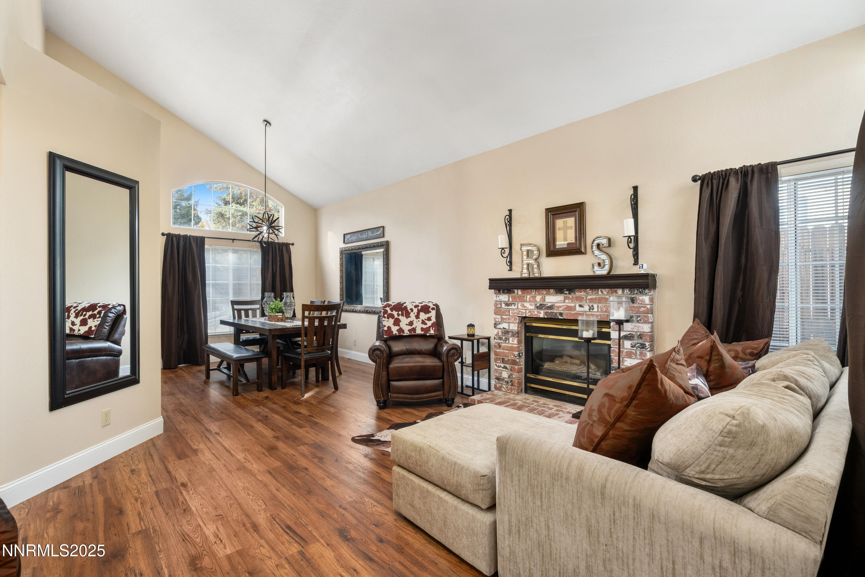 6310 Park Place Reno, NV 89523 - Photo 5 of 43 a living room with furniture a fireplace and a flat screen tv