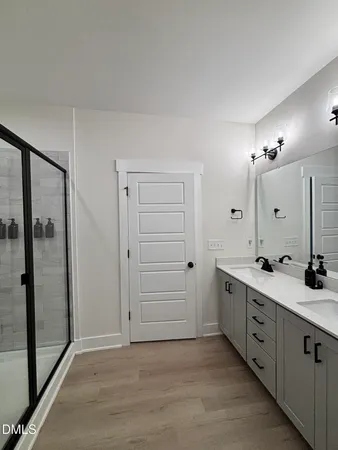 a large kitchen with kitchen island a sink stainless steel appliances and window