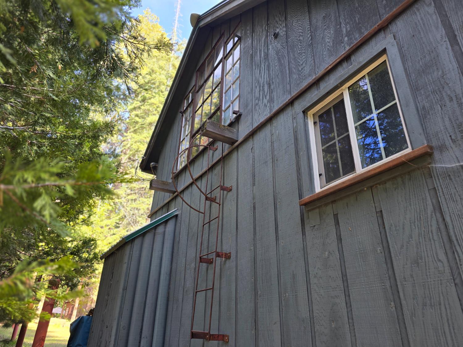 83703 Hazel Lane Wilsonia, CA 93633 - Photo 6 of 22 a view of building with wooden stairs and deck