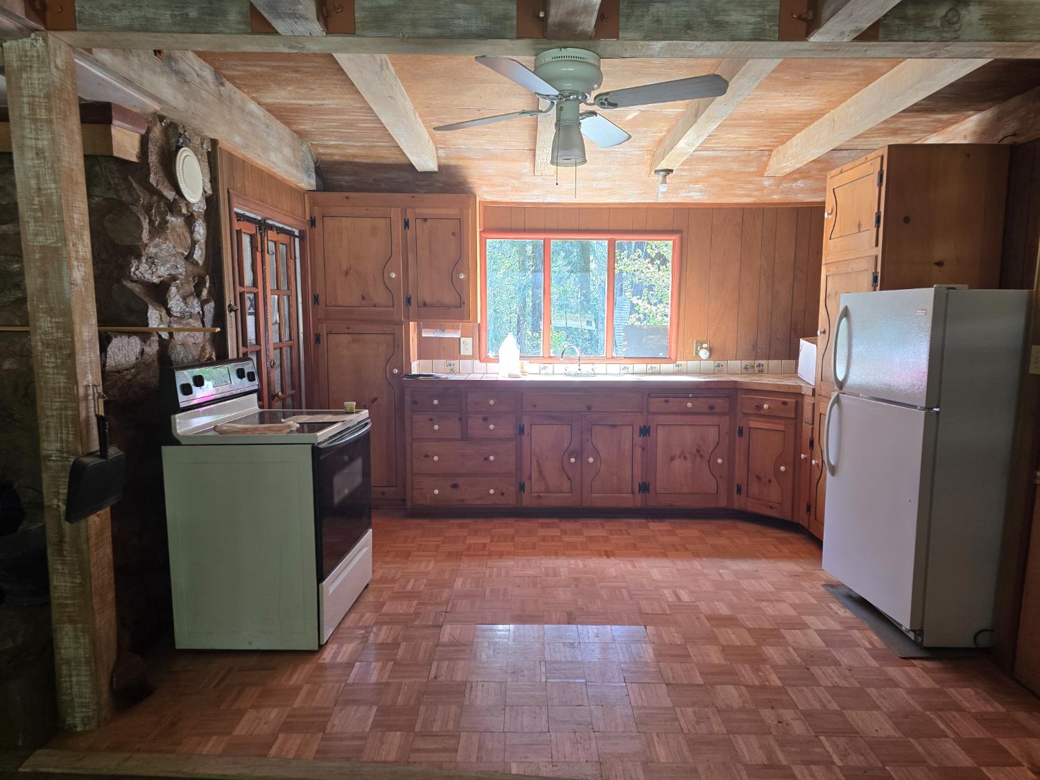 83703 Hazel Lane Wilsonia, CA 93633 - Photo 9 of 22 a view of a kitchen with fridge and front door