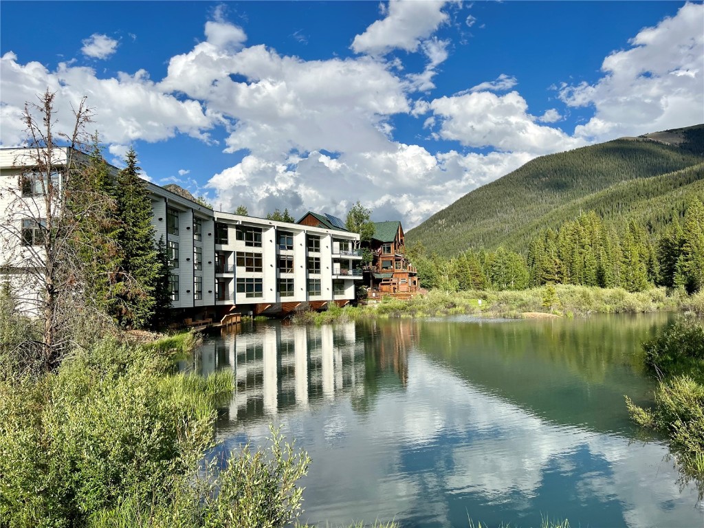 a view of a lake with a building in the background