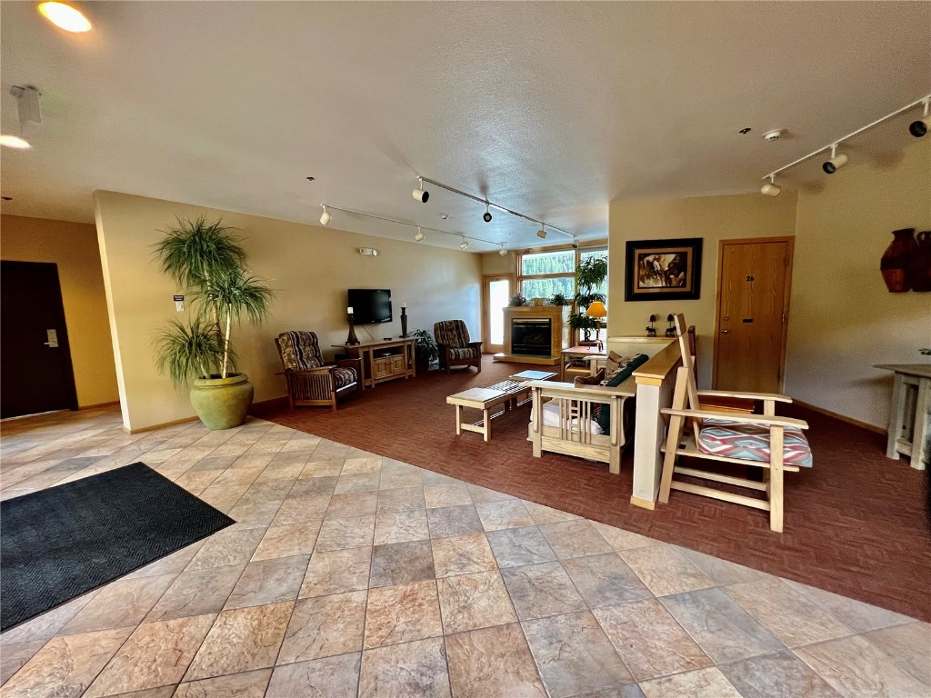 24 River Run Road, Unit 2911 Keystone, CO 80435 - Photo 14 of 24 a living room with furniture and a flat screen tv