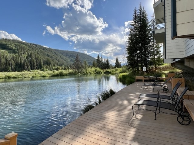 24 River Run Road, Unit 2911 Keystone, CO 80435 - Photo 18 of 24 a lake view with a bench