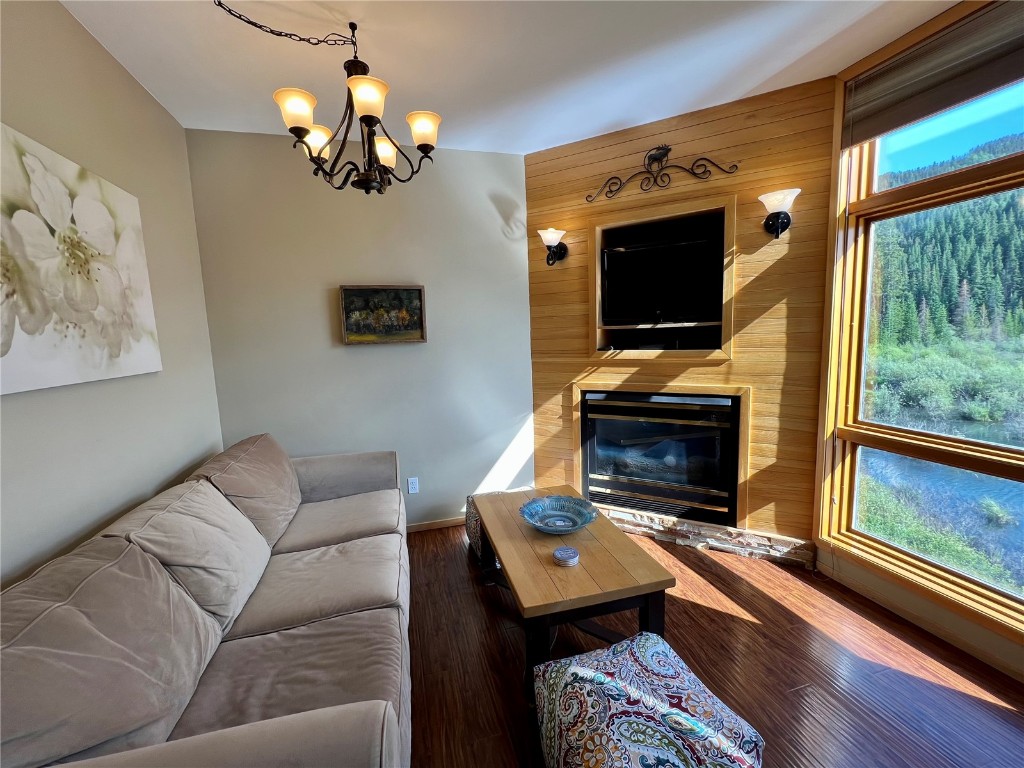 24 River Run Road, Unit 2911 Keystone, CO 80435 - Photo 4 of 24 a living room with furniture a flat screen tv and a fireplace