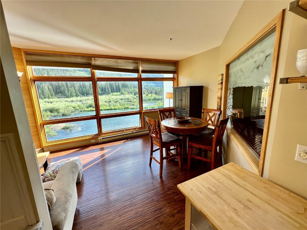 24 River Run Road, Unit 2911 Keystone, CO 80435 - Photo 6 of 24 a view of a dining room with furniture window and wooden floor
