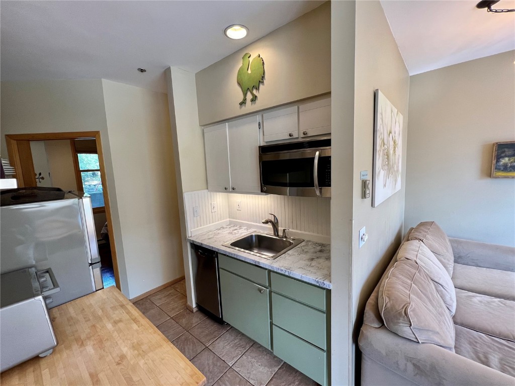24 River Run Road, Unit 2911 Keystone, CO 80435 - Photo 7 of 24 a living room with furniture and a fireplace