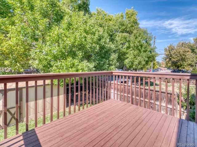 a view of balcony with wooden floor