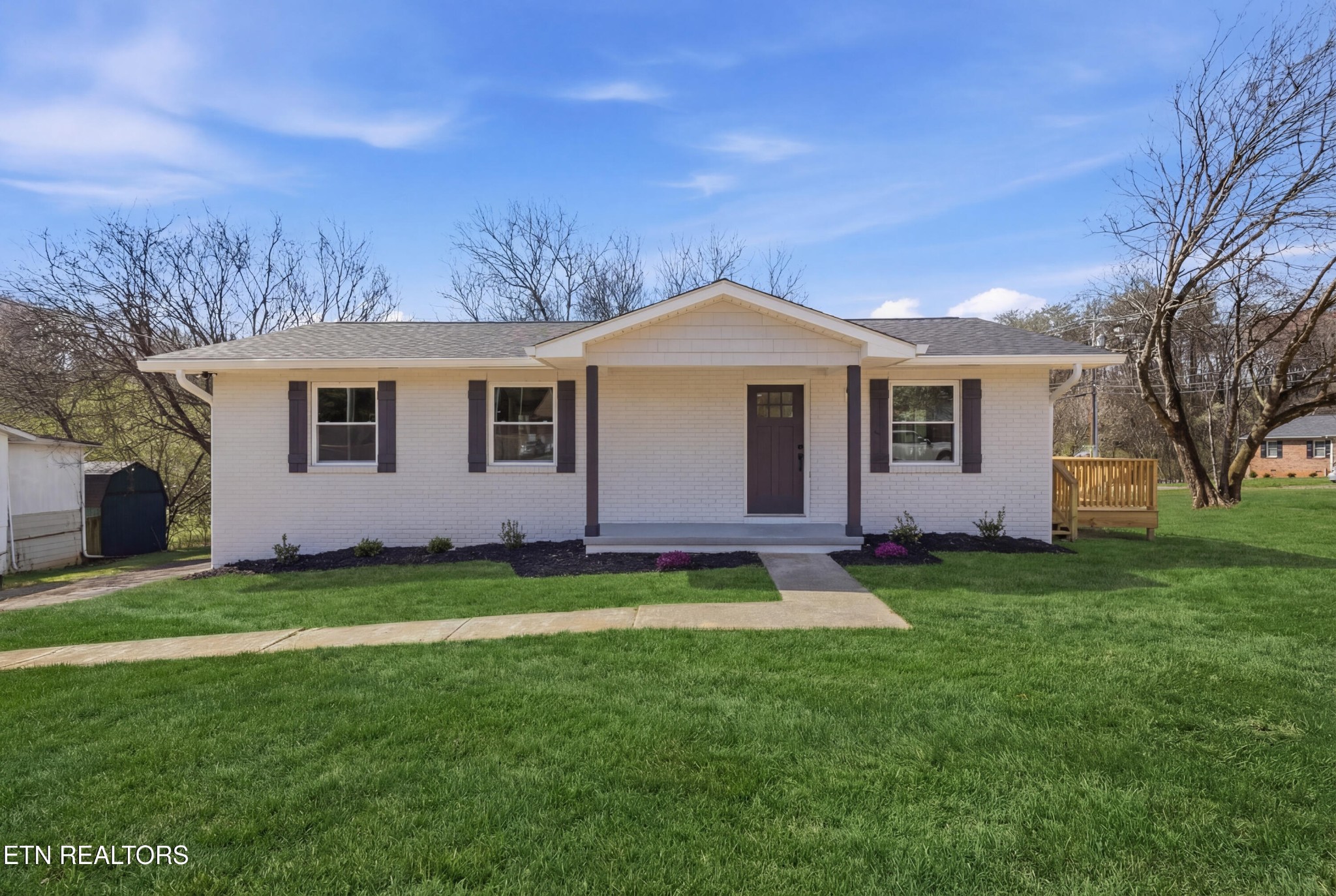 2241 Woods-Smith Road Knoxville, TN 37921 - Photo 1 of 37 a front view of a house with a garden
