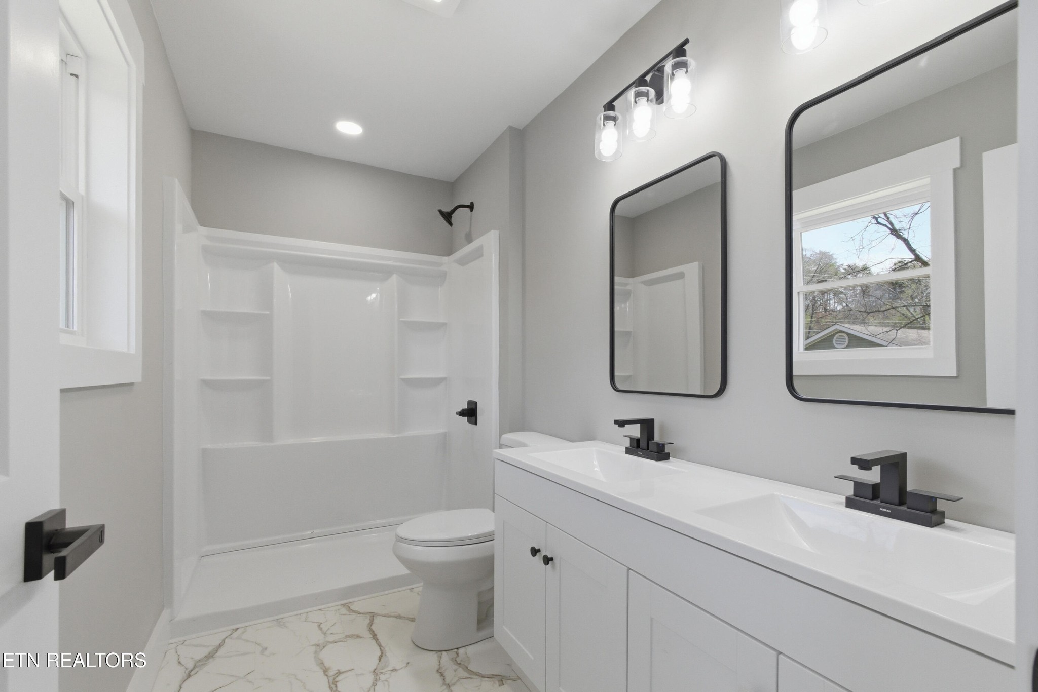 2241 Woods-Smith Road Knoxville, TN 37921 - Photo 21 of 37 a bathroom with a toilet sink double vanity and tub