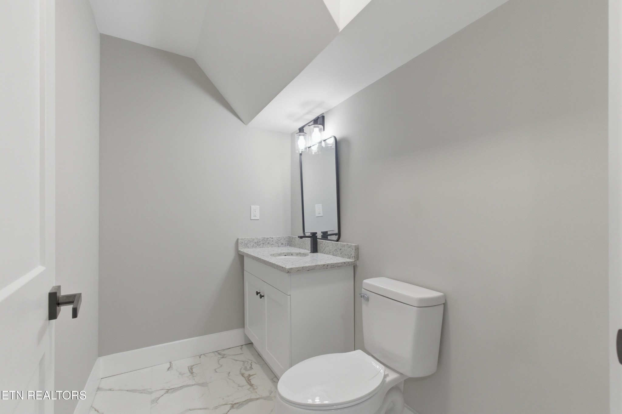 2241 Woods-Smith Road Knoxville, TN 37921 - Photo 28 of 37 a bathroom with a sink toilet and mirror