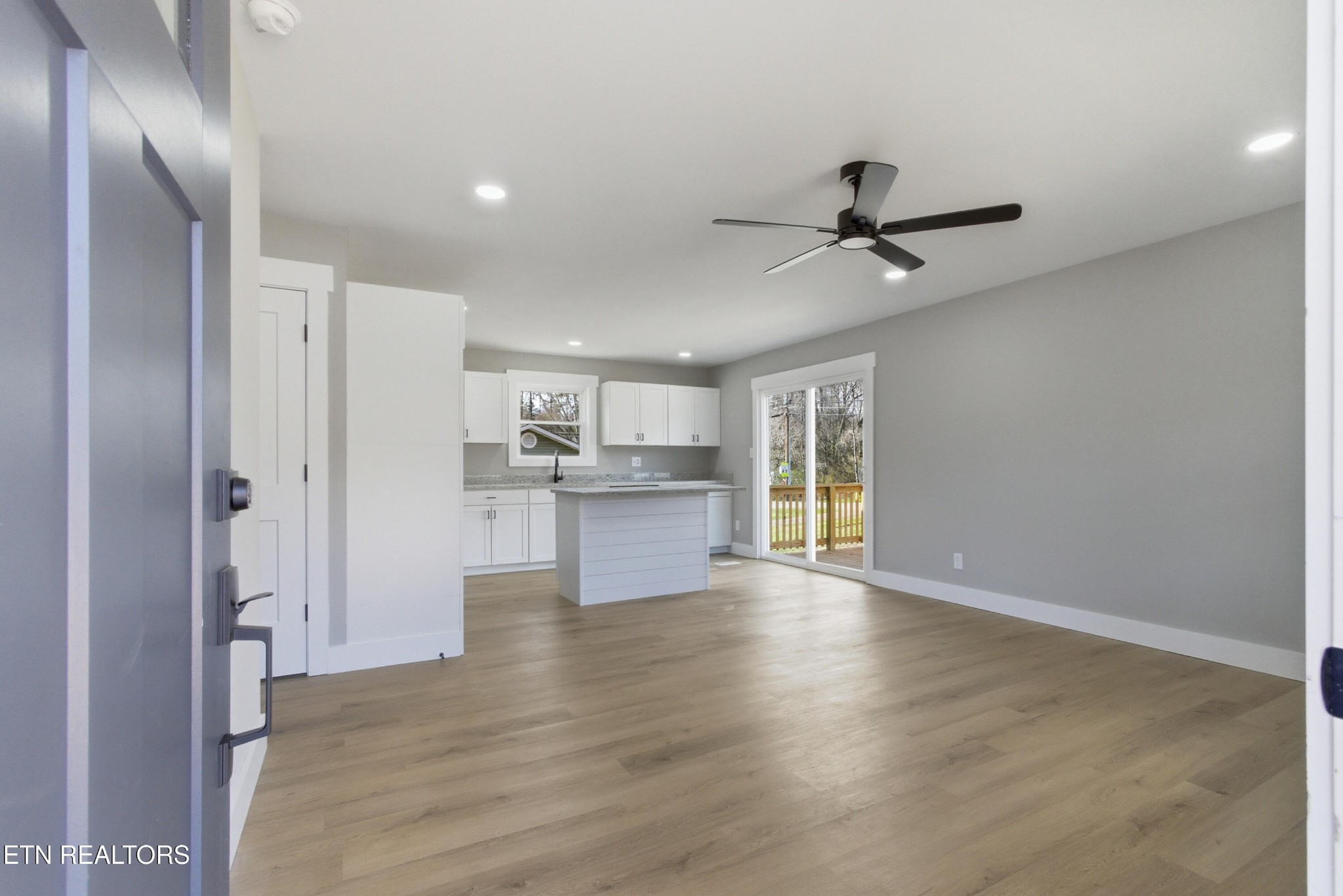 2241 Woods-Smith Road Knoxville, TN 37921 - Photo 6 of 37 a view of a kitchen with wooden floor and a kitchen