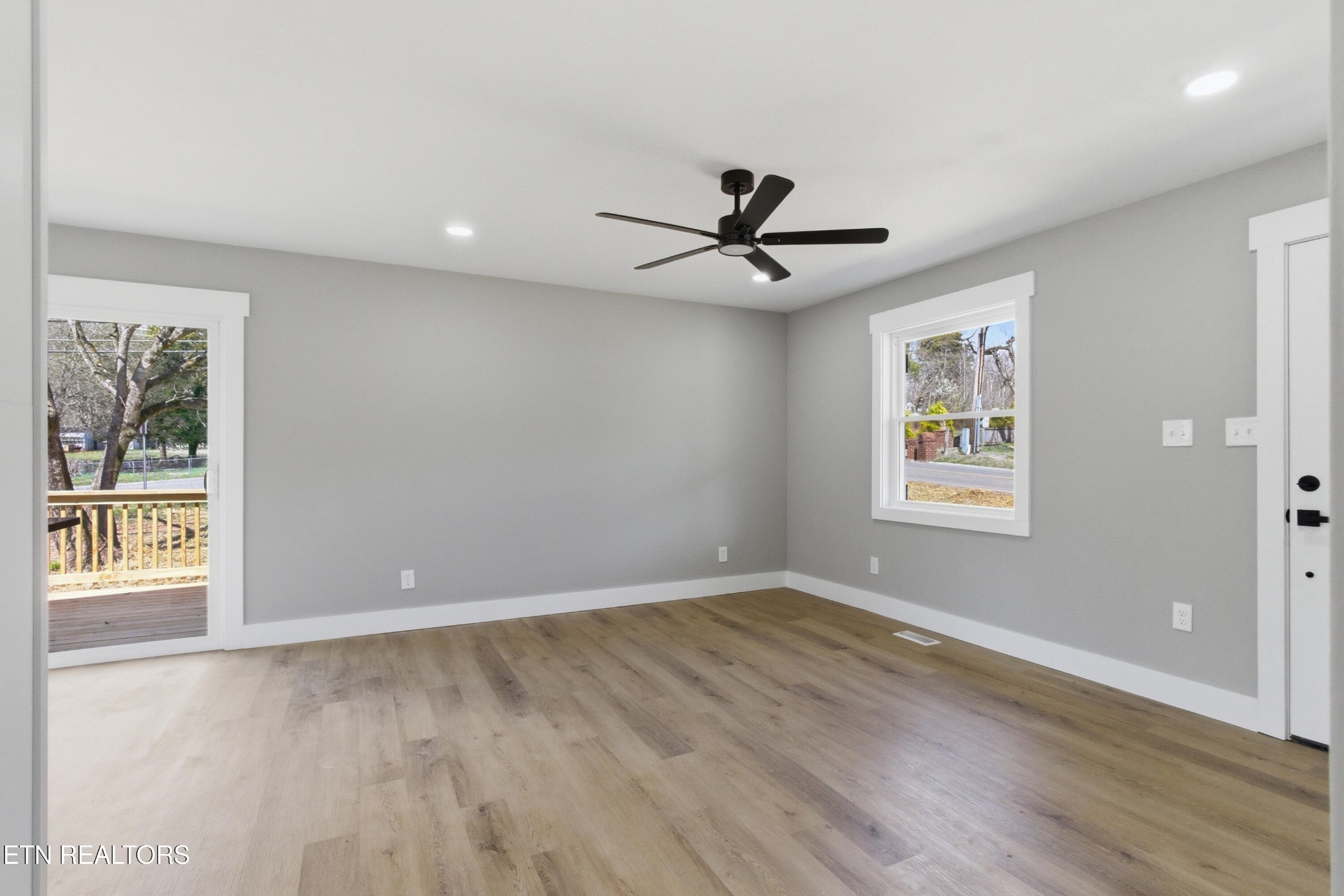 2241 Woods-Smith Road Knoxville, TN 37921 - Photo 9 of 37 a view of an empty room with a window and wooden floor