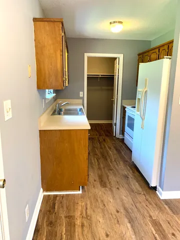 a bathroom with a sink a mirror and a toilet