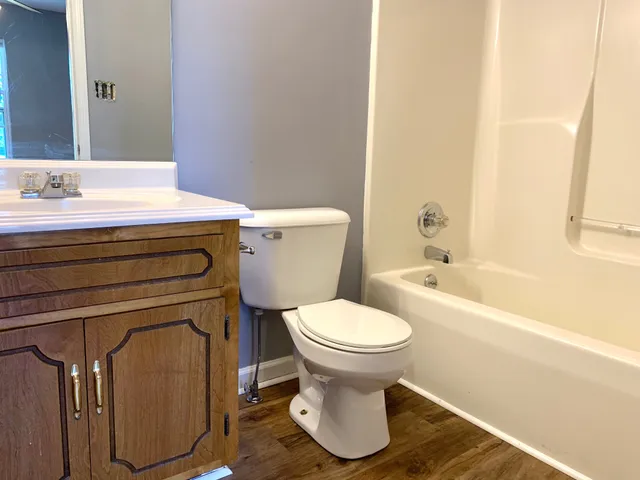 a bathroom with a sink toilet and bathtub