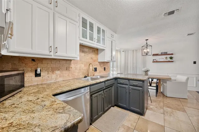 a bedroom with a bed and a television