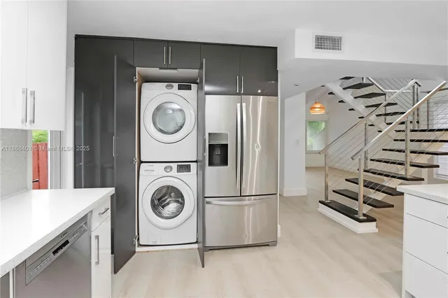 a utility room with dryer and washer