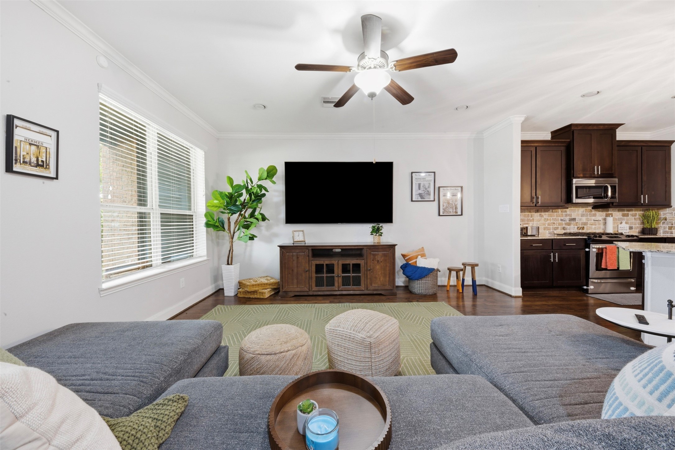 706 Water Street Webster, TX 77598 - Photo 9 of 23 Seamless flow and warm finishes create a space that feels both relaxed and refined. Includes 3 HUGE TV's!
