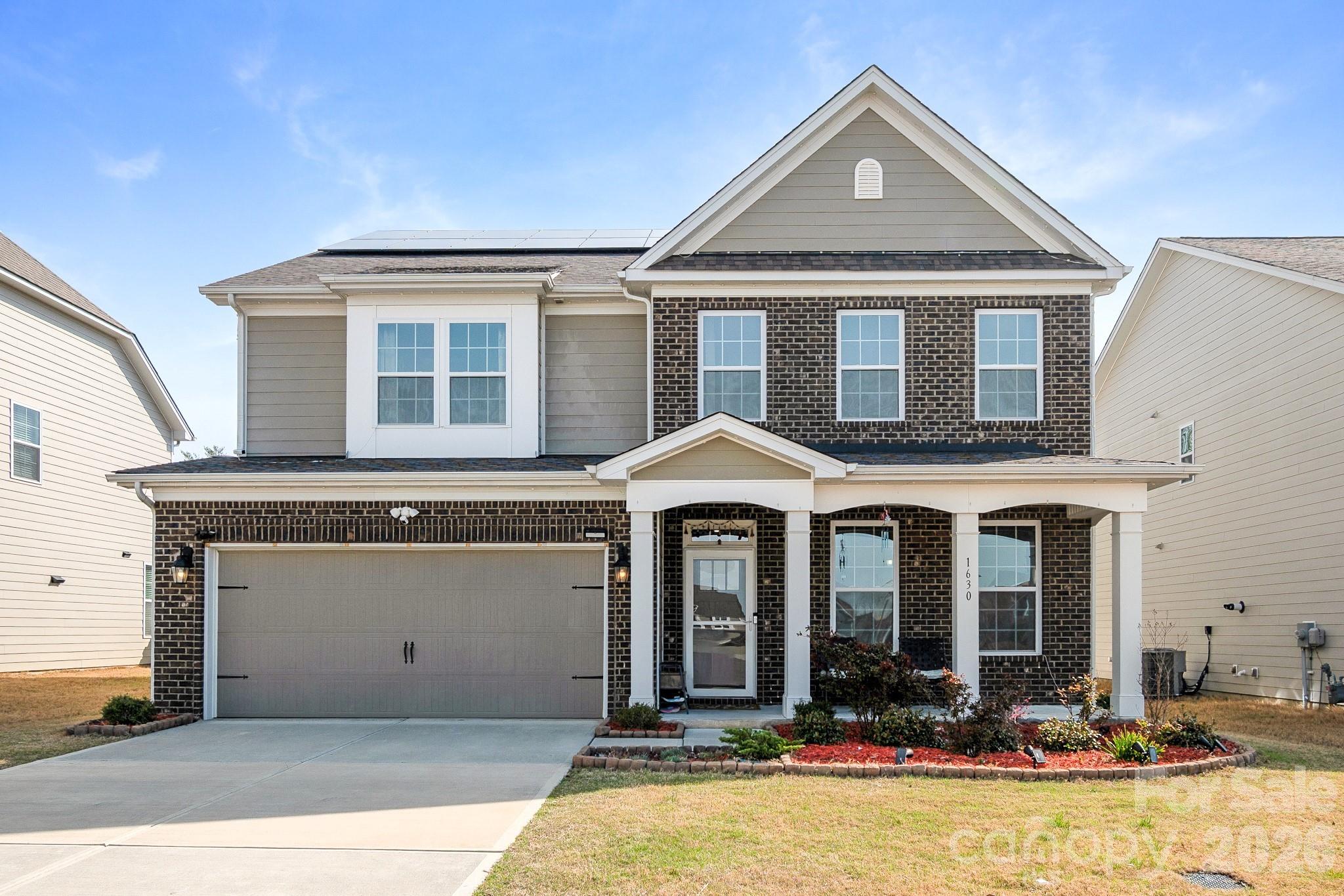 1630 Fitzgerald Street Northwest Concord, NC 28027 - Photo 1 of 38 a front view of a house with yard