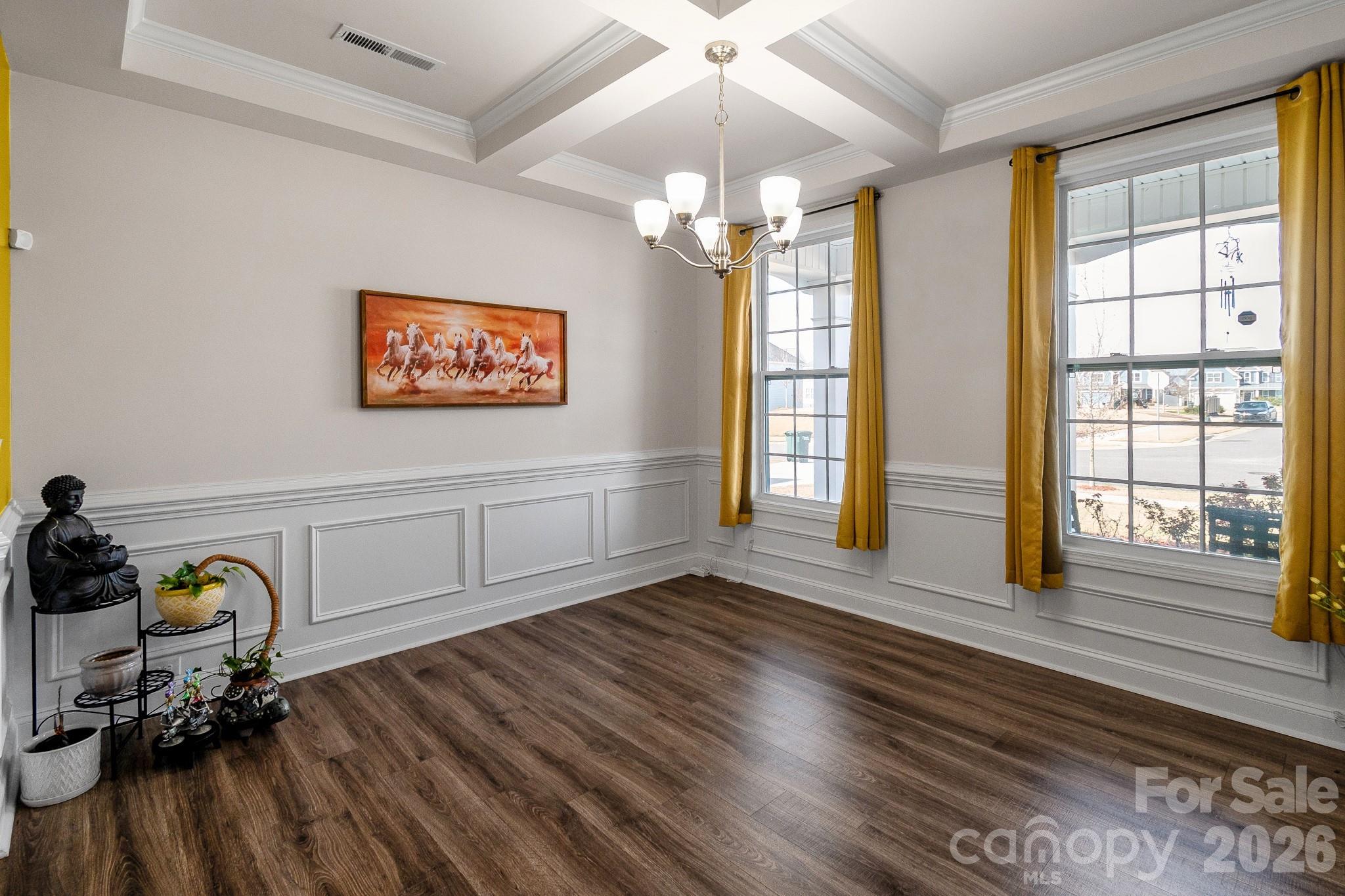 1630 Fitzgerald Street Northwest Concord, NC 28027 - Photo 11 of 38 a view of a room with wooden floor and windows