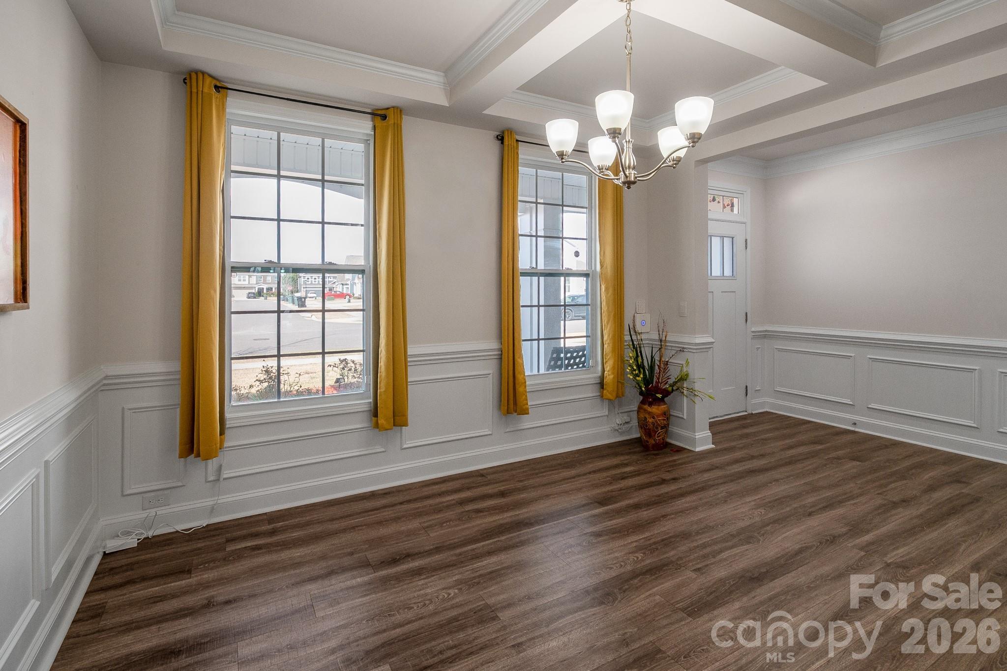 1630 Fitzgerald Street Northwest Concord, NC 28027 - Photo 12 of 38 wooden floor in an empty room with a window