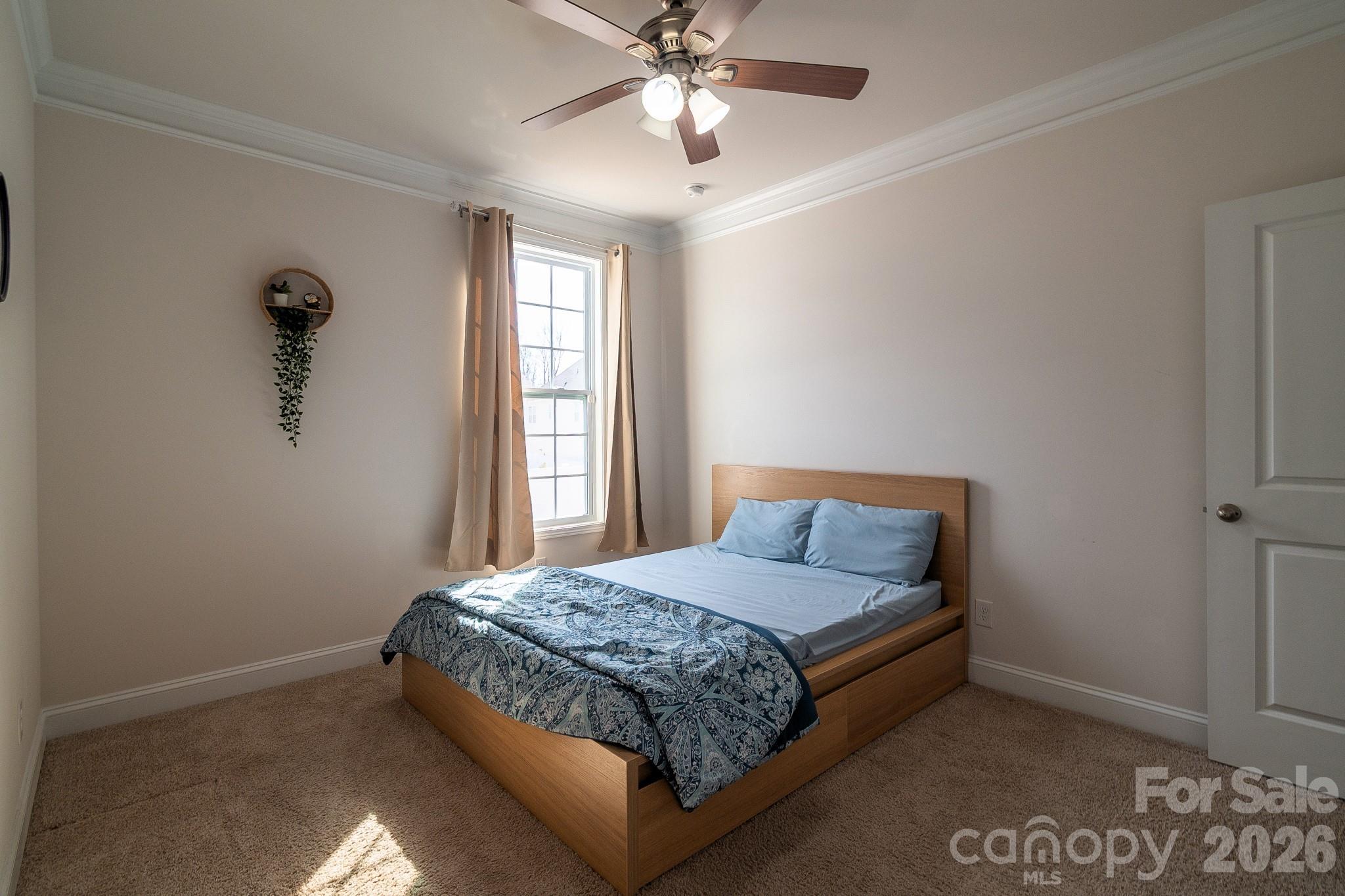 1630 Fitzgerald Street Northwest Concord, NC 28027 - Photo 13 of 38 a bedroom with a bed and window