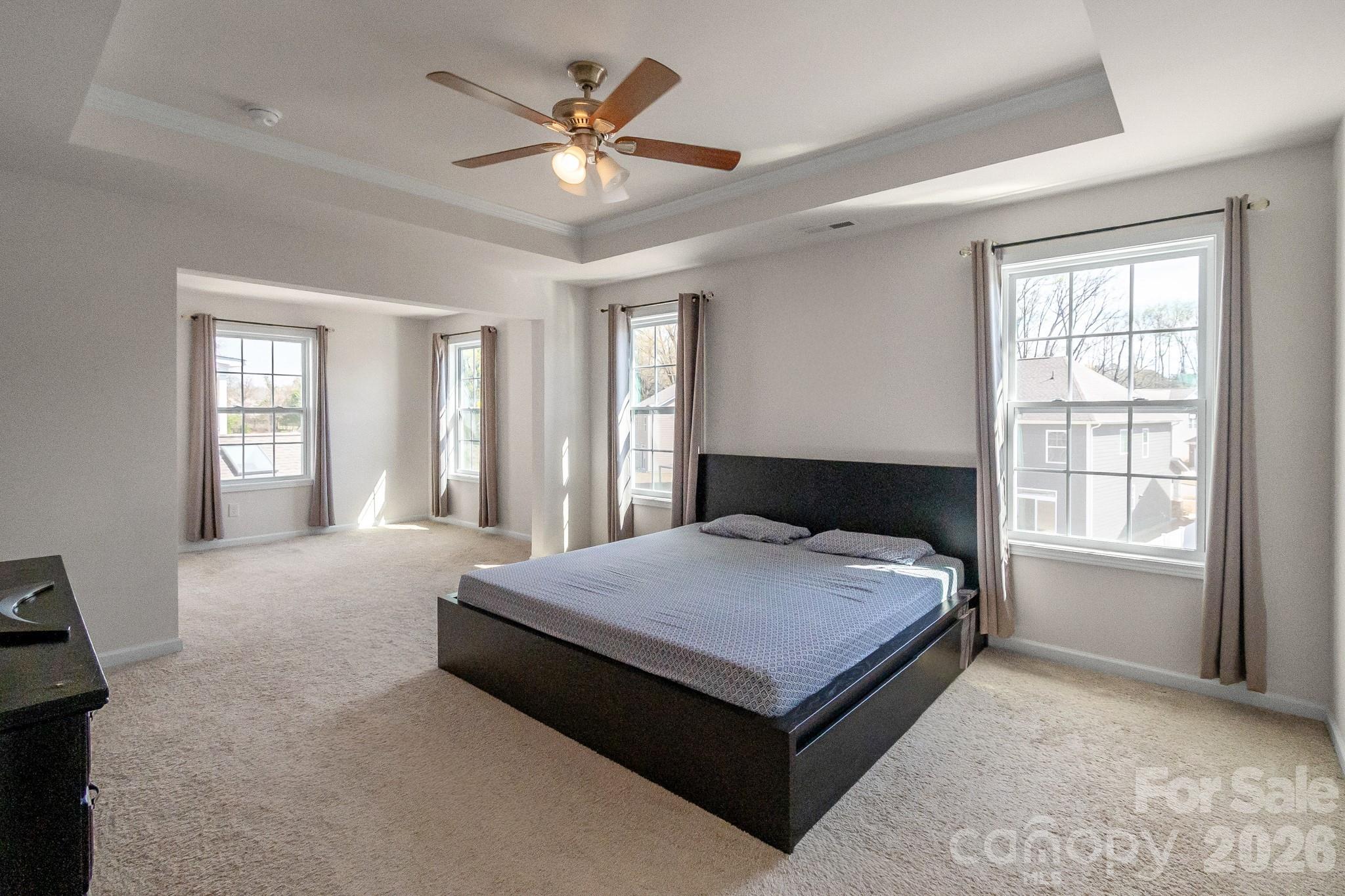 1630 Fitzgerald Street Northwest Concord, NC 28027 - Photo 19 of 38 a spacious bedroom with a bed and window