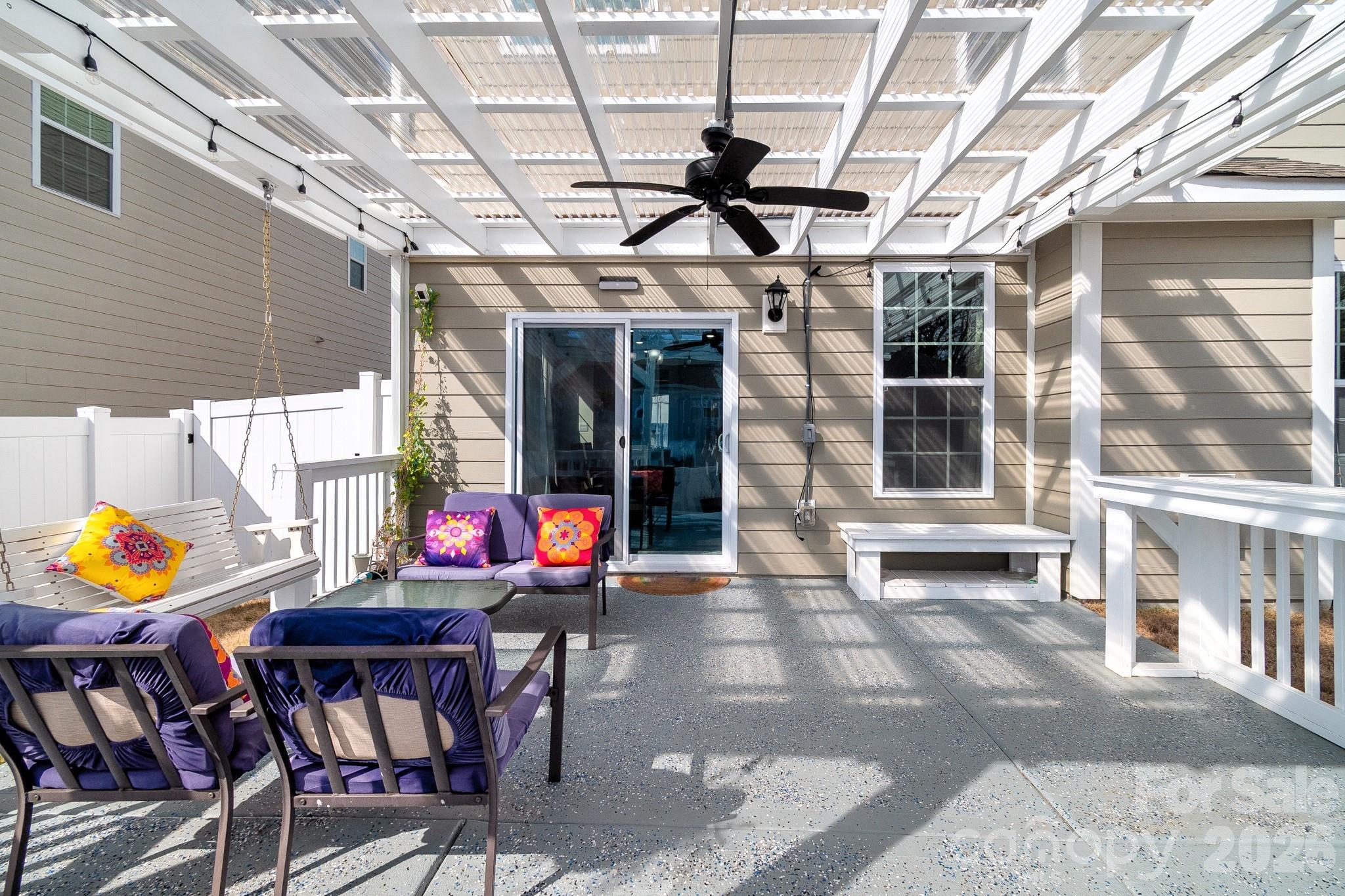 1630 Fitzgerald Street Northwest Concord, NC 28027 - Photo 2 of 38 a view of a chairs and table in a patio