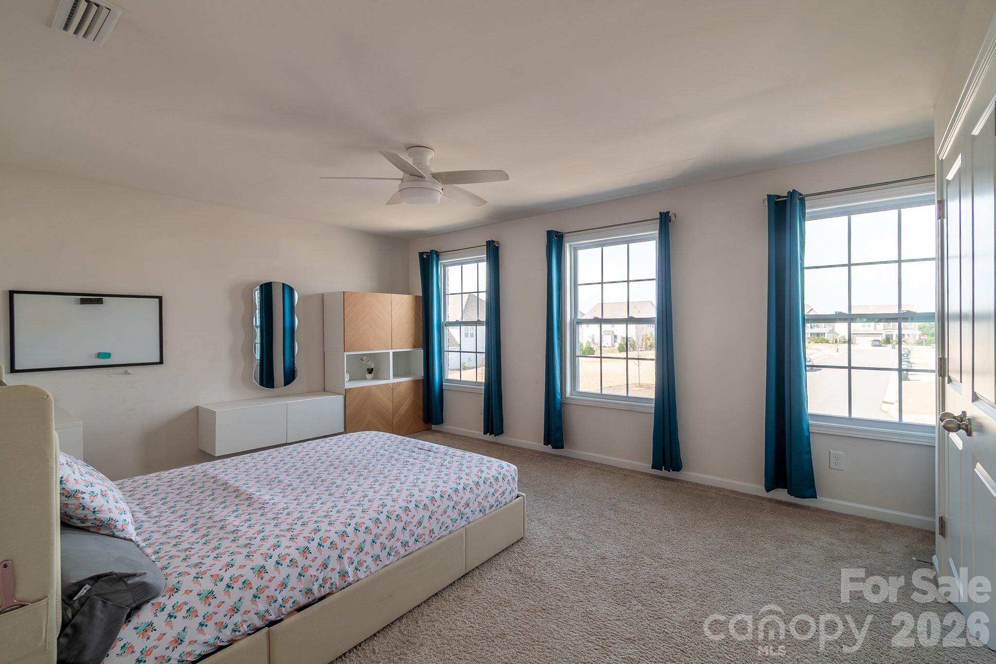 1630 Fitzgerald Street Northwest Concord, NC 28027 - Photo 26 of 38 a bedroom with a large bed and a window