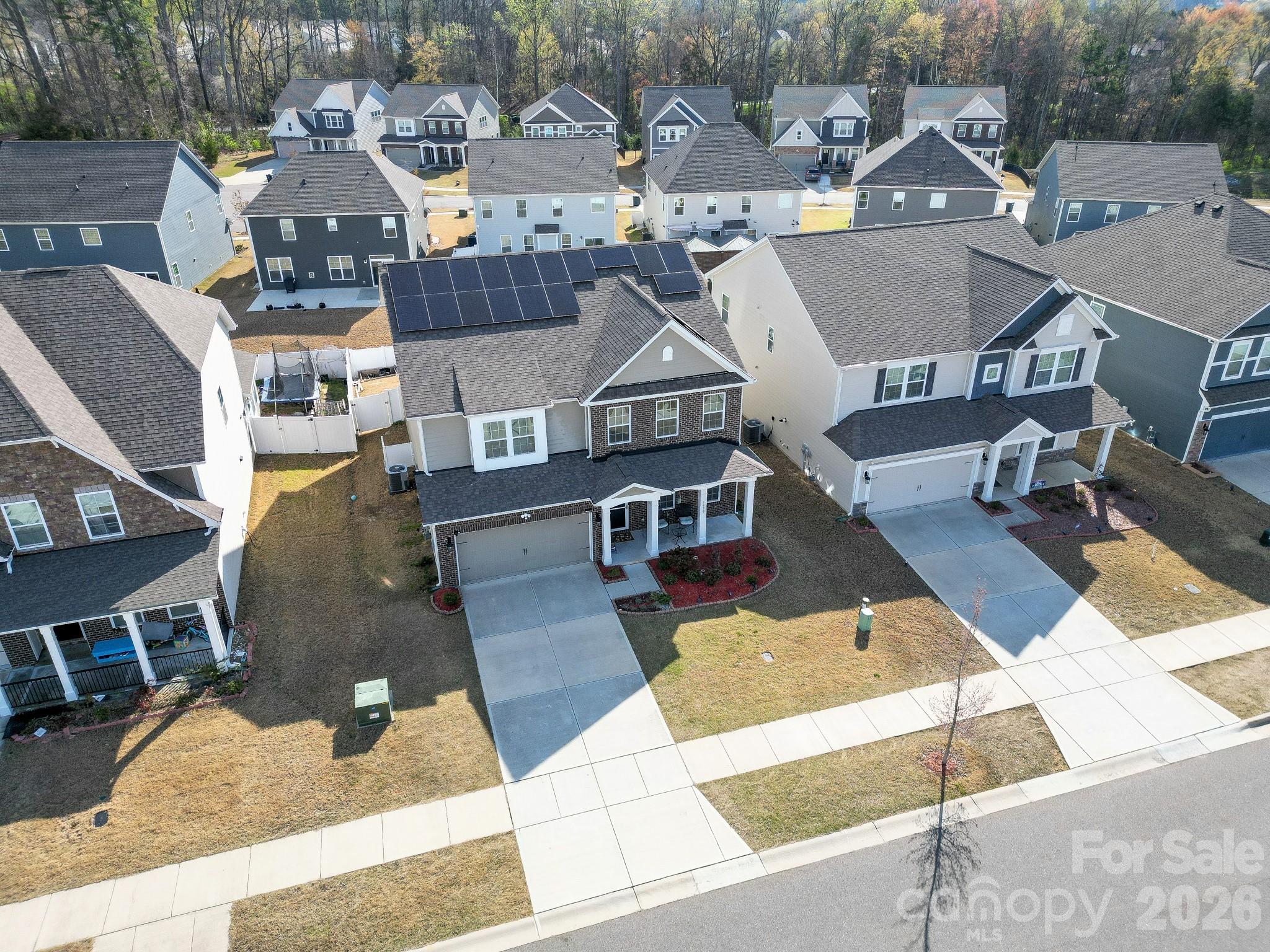 1630 Fitzgerald Street Northwest Concord, NC 28027 - Photo 36 of 38 an aerial view of residential houses with outdoor space and parking