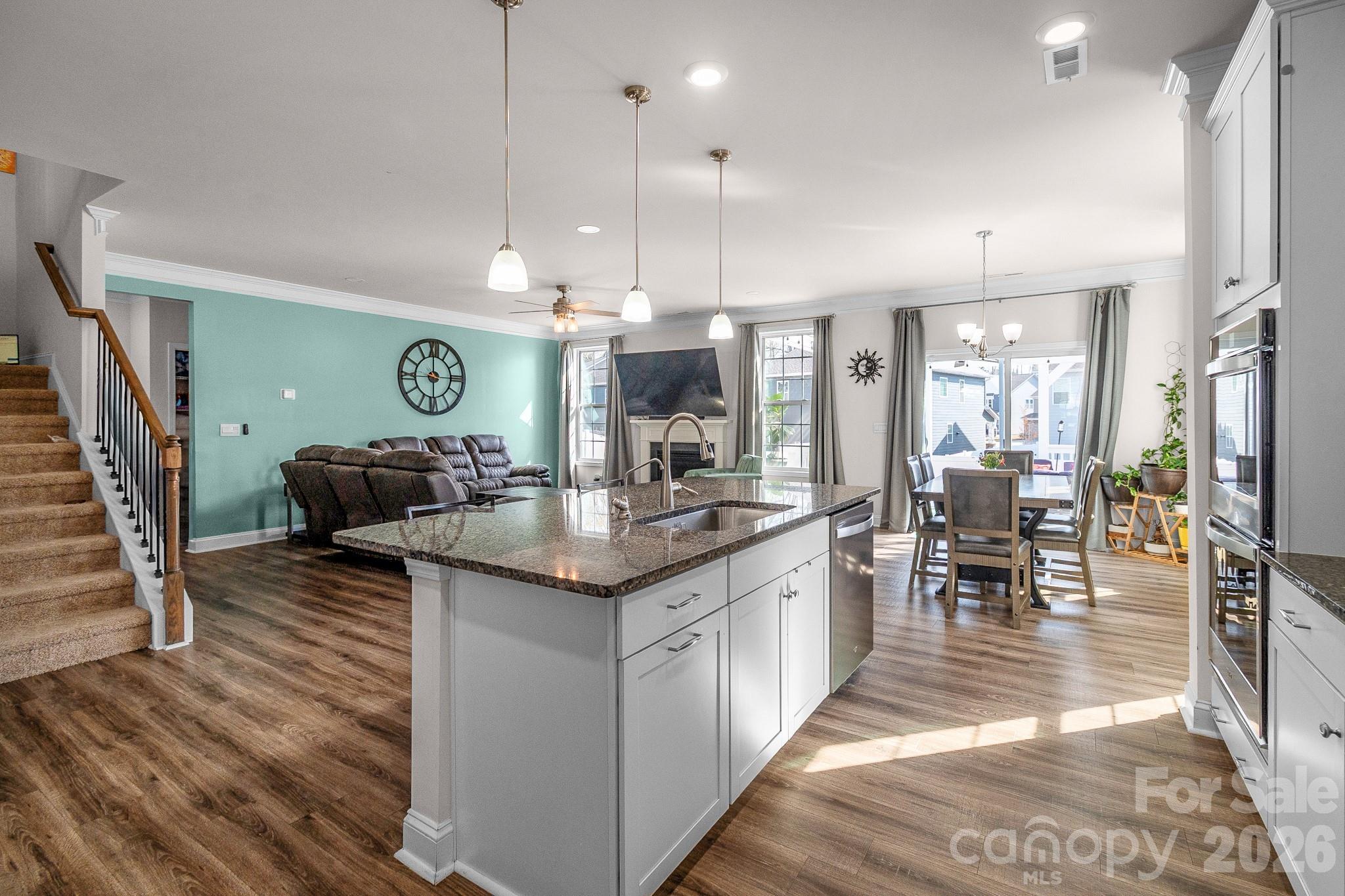 1630 Fitzgerald Street Northwest Concord, NC 28027 - Photo 4 of 38 a kitchen with lots of counter space and furniture