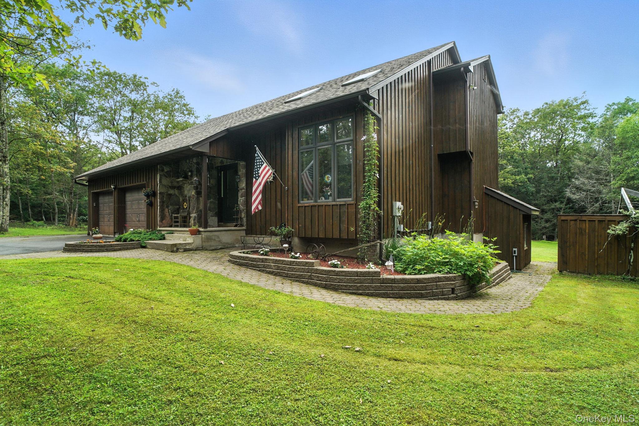 139 Renner Road Mountain Dale, NY 12763 - Photo 1 of 49 View of front of property featuring a garage, a front lawn, and driveway