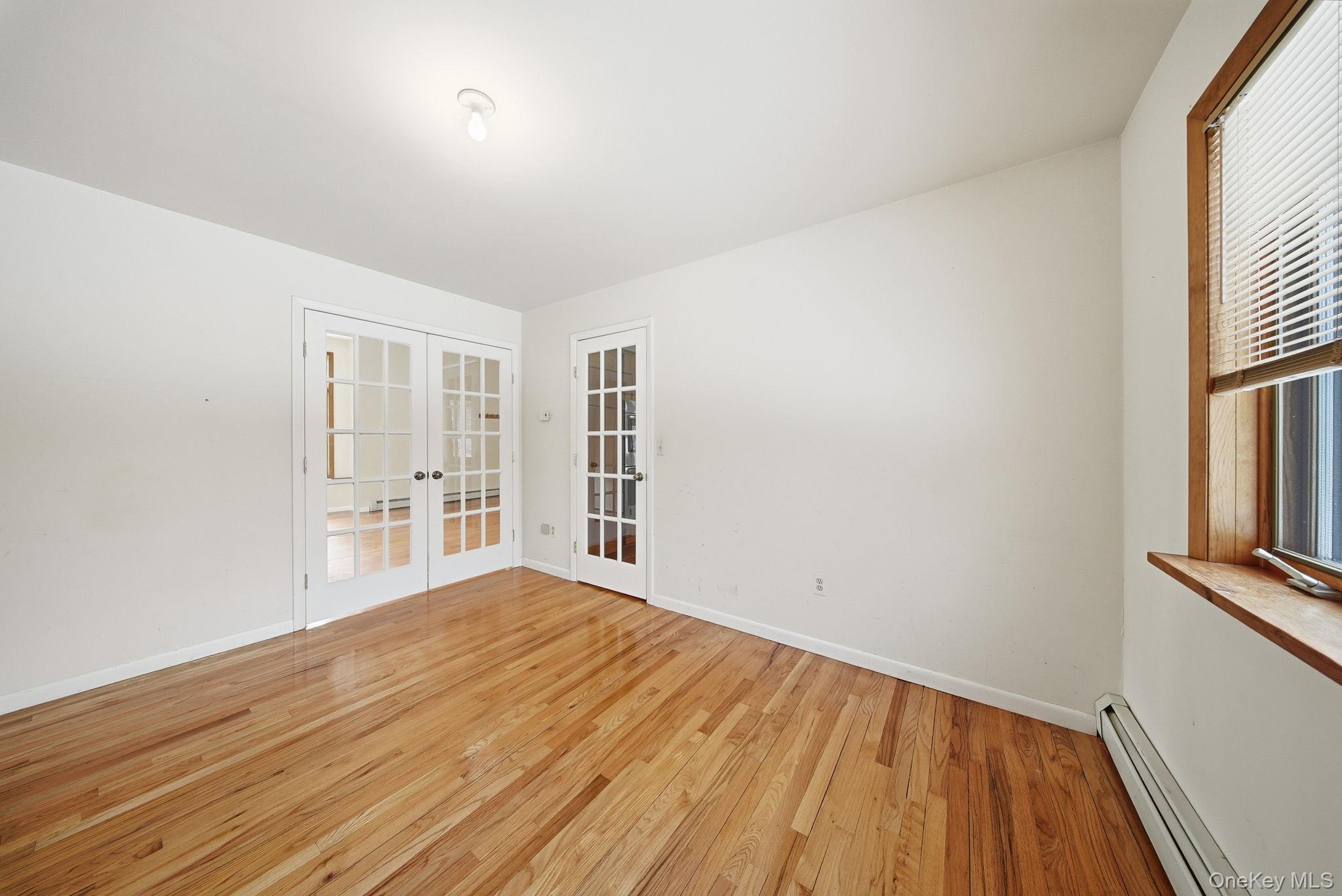 139 Renner Road Mountain Dale, NY 12763 - Photo 15 of 49 a view of an empty room with wooden floor and a window
