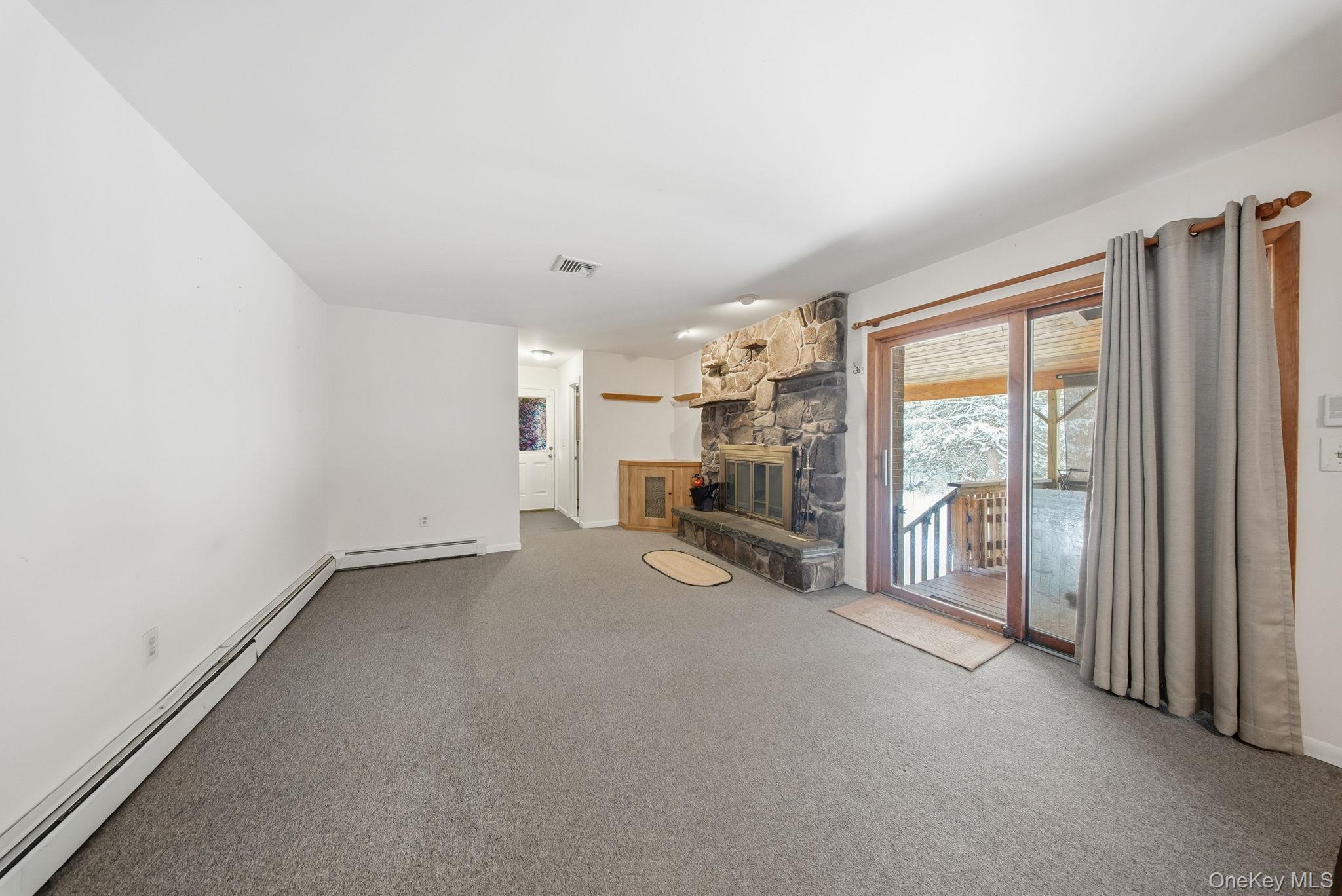 139 Renner Road Mountain Dale, NY 12763 - Photo 16 of 49 a view of empty room with floor to ceiling window