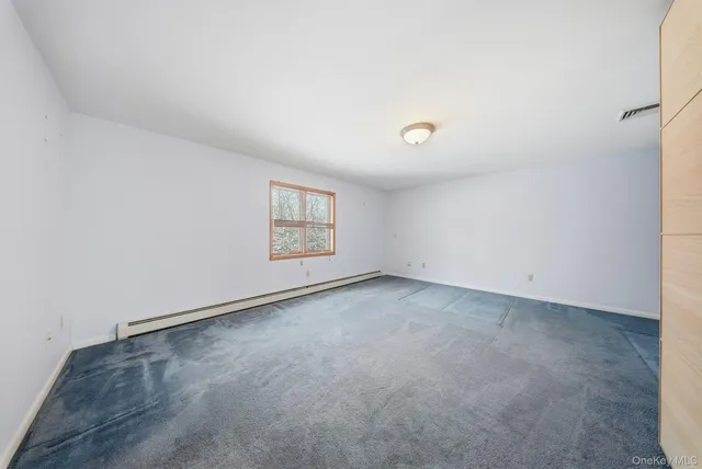 a bathroom with a sink a toilet a mirror and shower