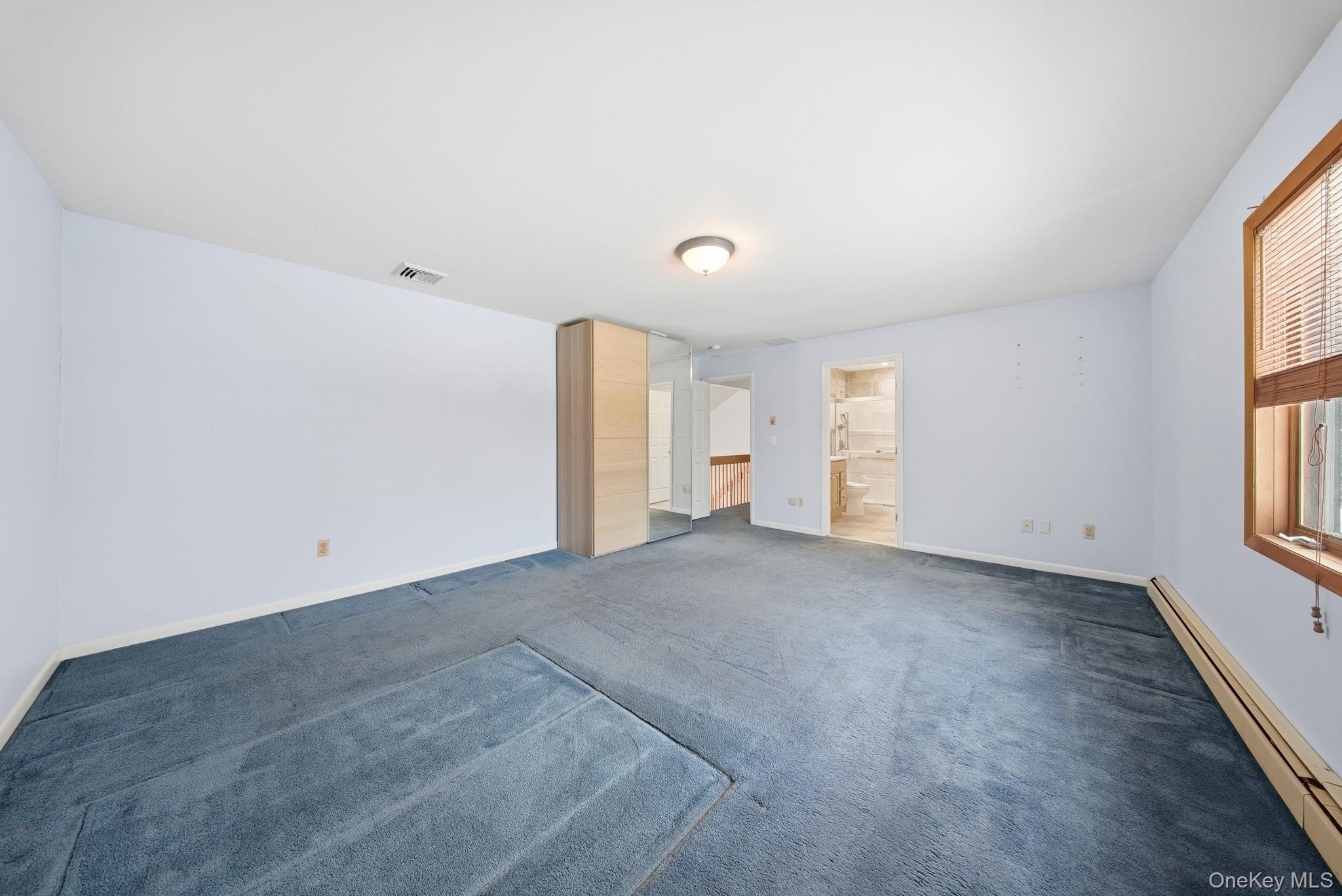 139 Renner Road Mountain Dale, NY 12763 - Photo 23 of 49 Unfurnished room featuring baseboard heating and carpet flooring