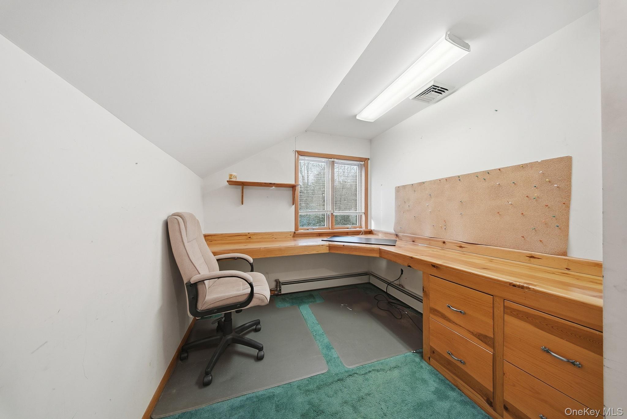 139 Renner Road Mountain Dale, NY 12763 - Photo 27 of 49 Home office with carpet, vaulted ceiling, built in desk