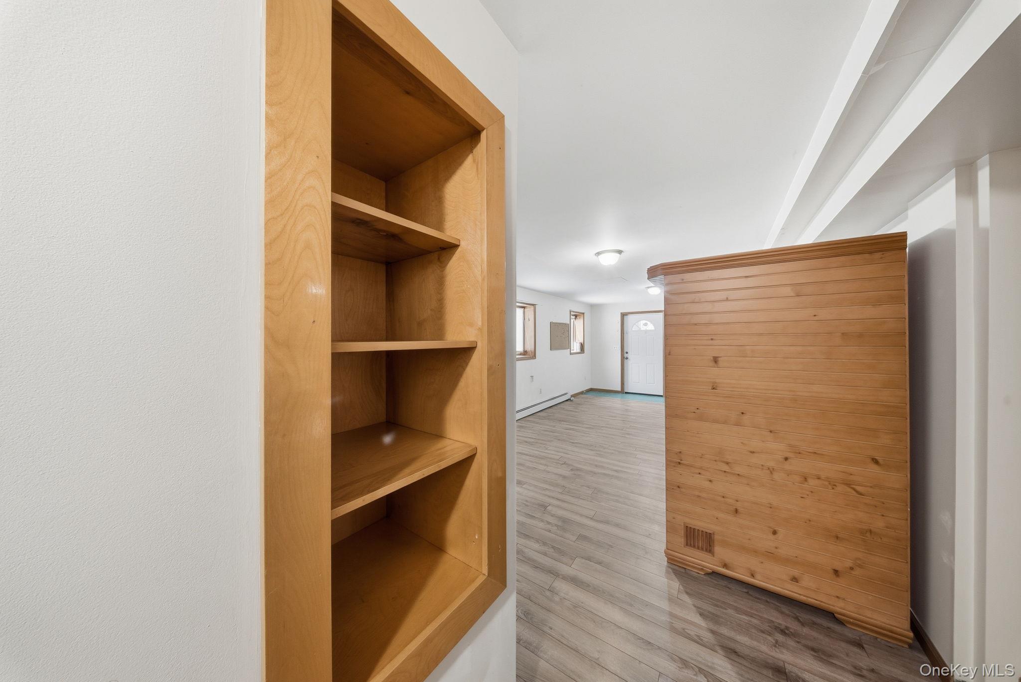 139 Renner Road Mountain Dale, NY 12763 - Photo 29 of 50 Corridor with light wood-style floors and a baseboard heating unit
